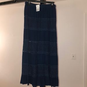 Navy blue knitted skirt with a mesh pattern.